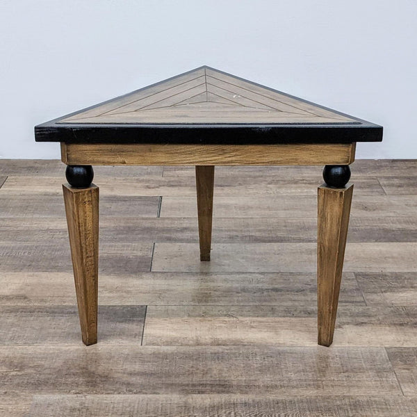 Triangular wooden console table with tapered legs and black trim by Reperch.