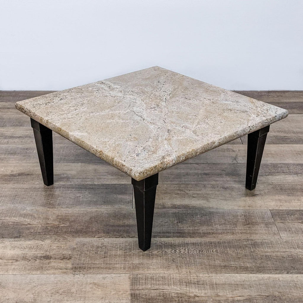 2. Minimalist coffee table with sturdy and stylish metal legs.  