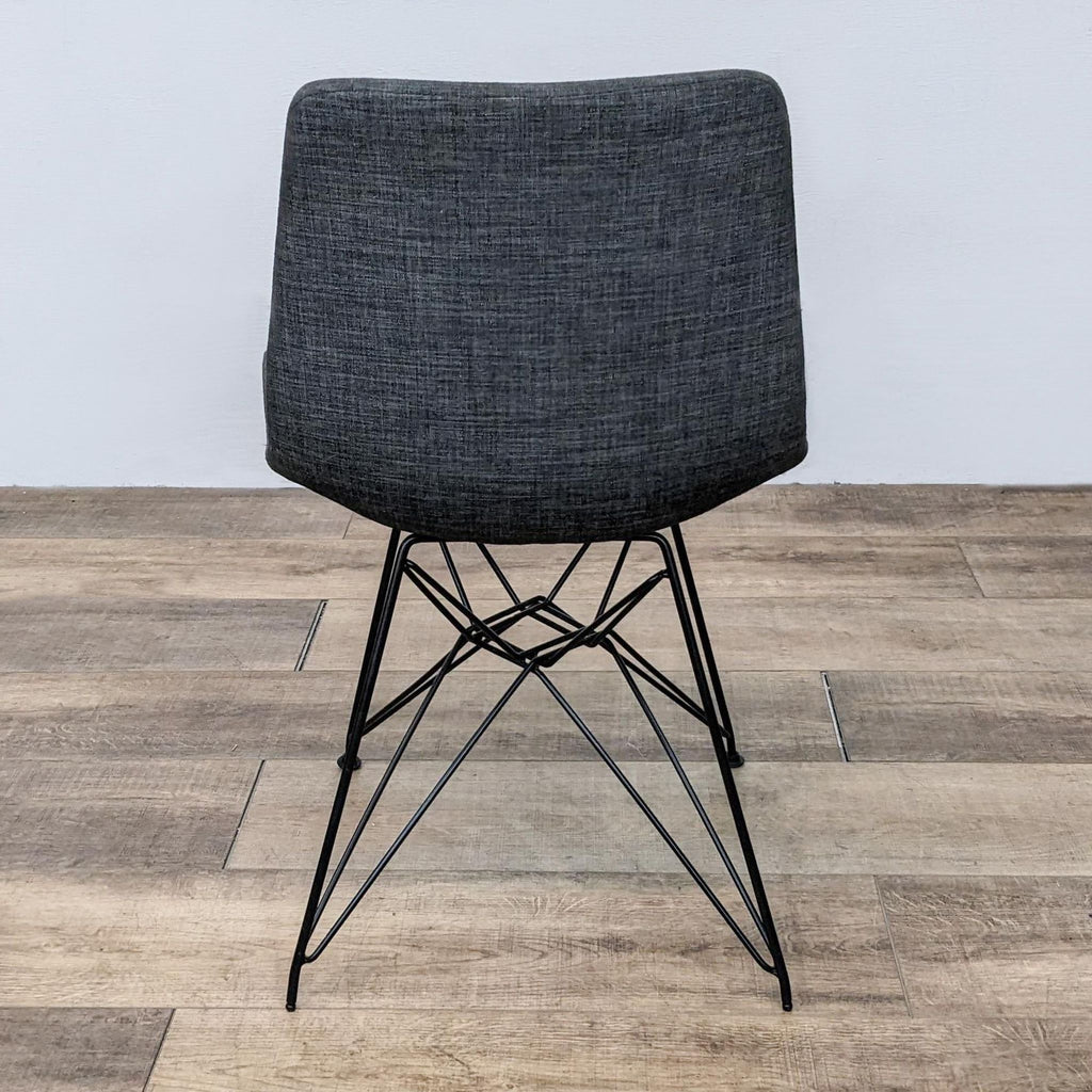 Back view of the Palmetto Chair, highlighting the fabric back and metal frame.