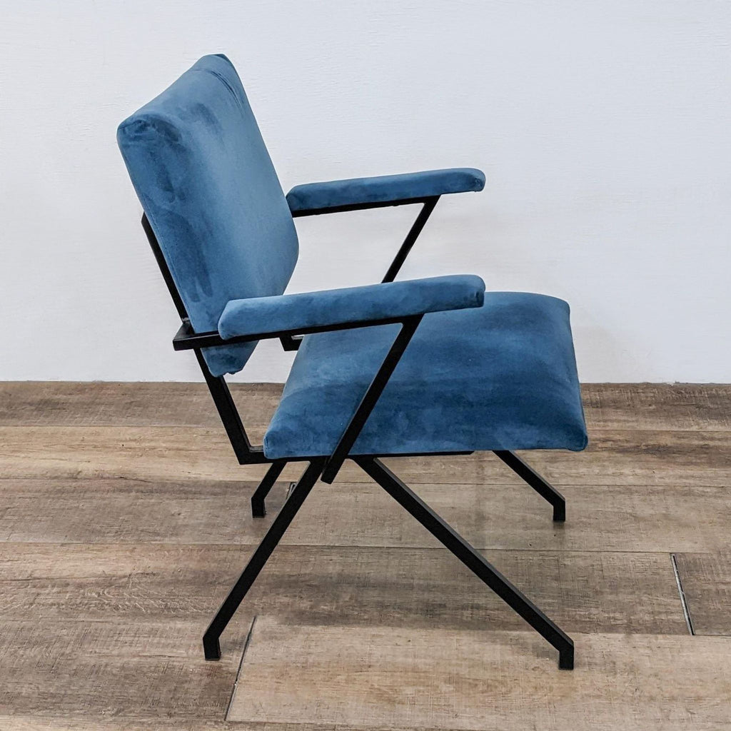 Side view of a Reperch dining chair with tubular black metal frame and plush microfiber upholstery.