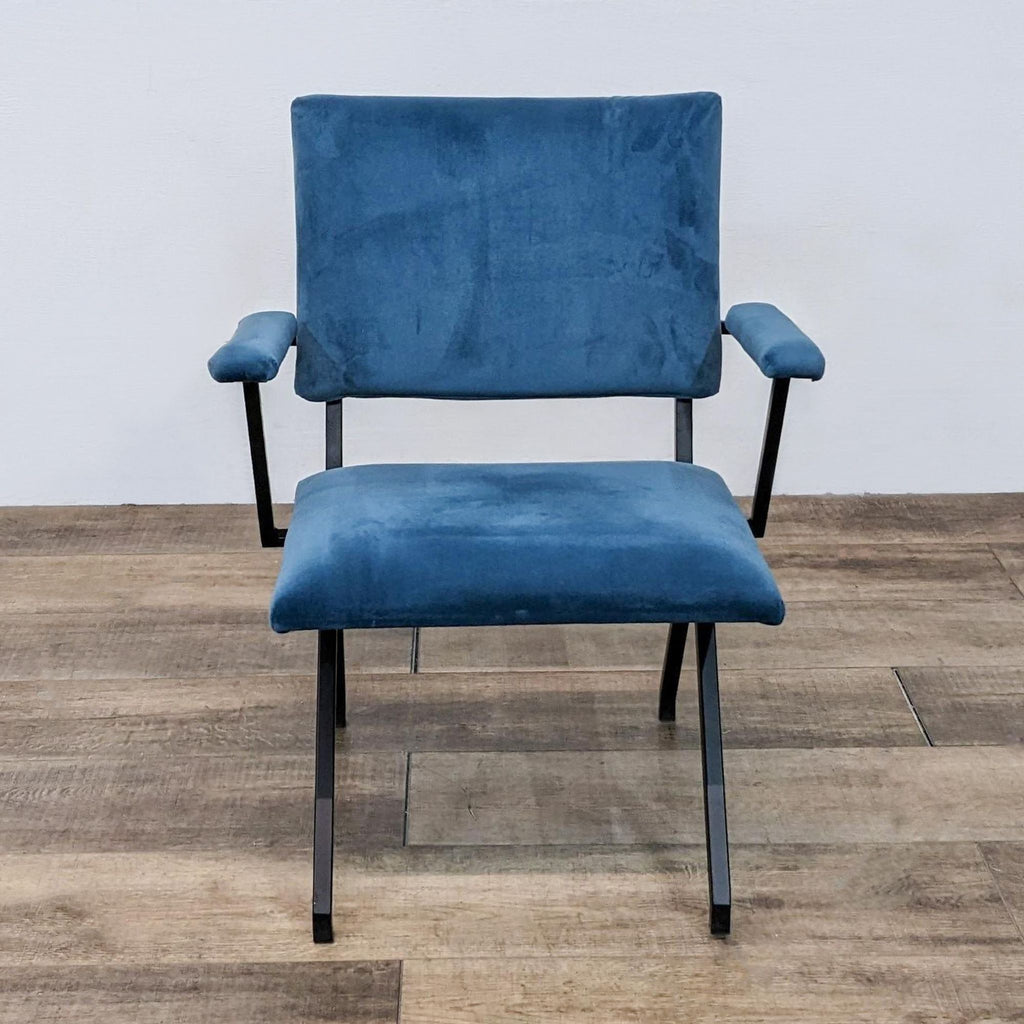 Front view of a blue microfiber dining chair with padded armrests and black metal frame.