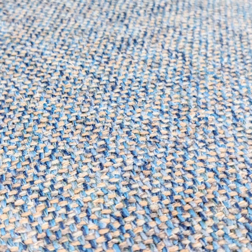 Close-up of blue-gray fabric texture on the stool.