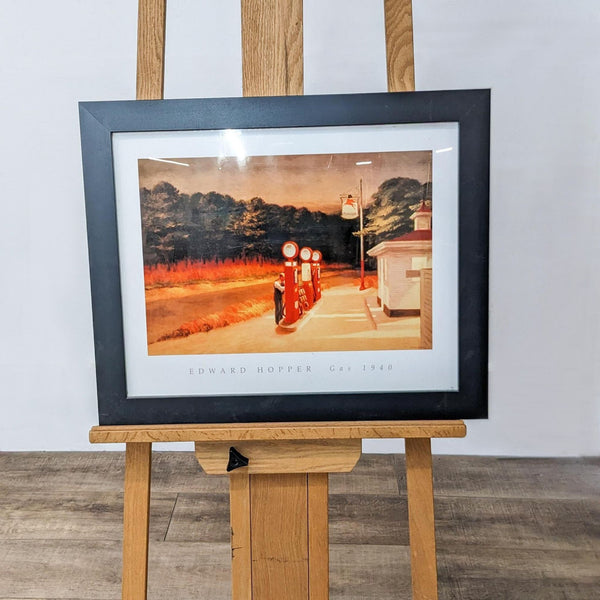 Framed art print titled "Gas" by Edward Hopper on an easel.