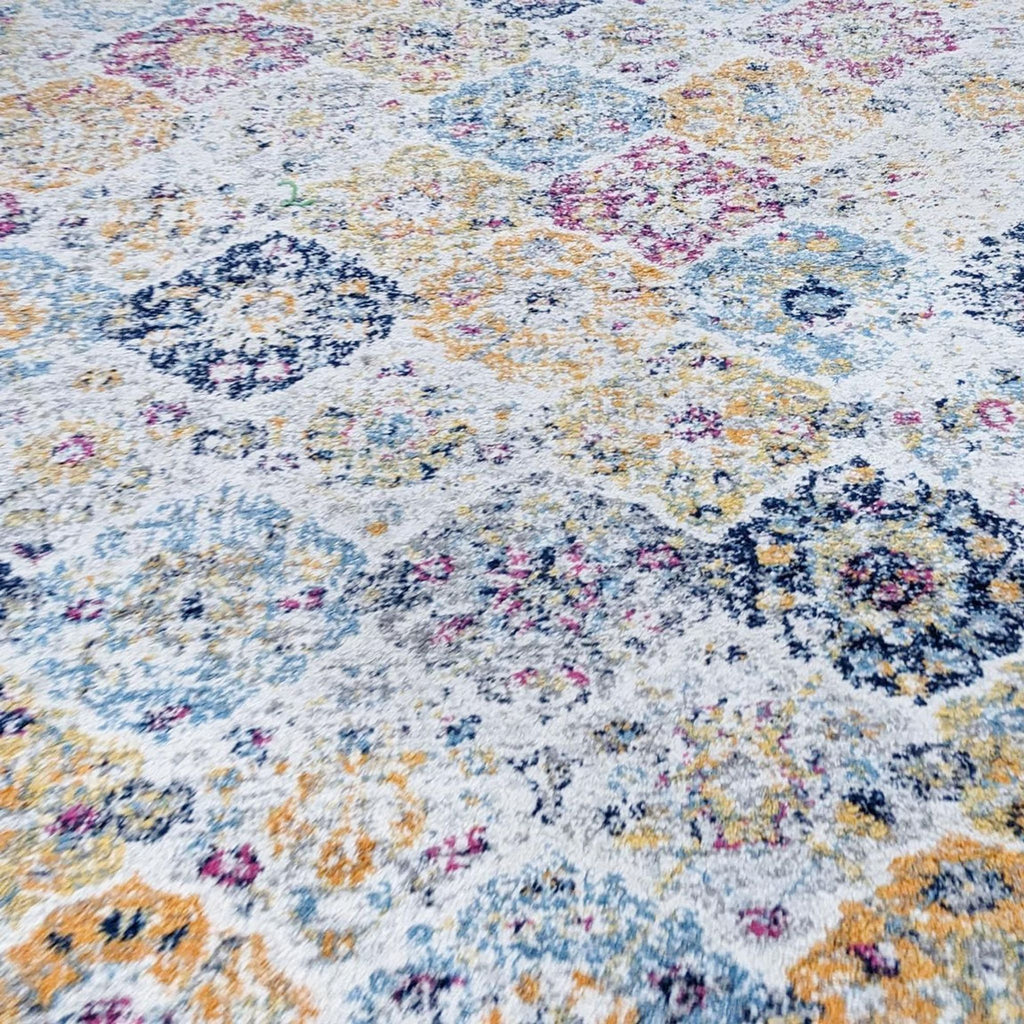 Close-up of the floral pattern on the Madison Home area rug.
