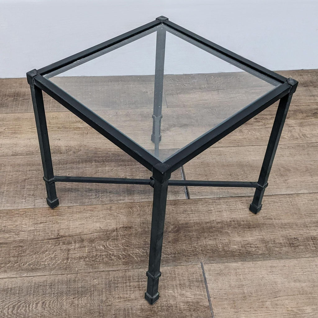 Designer accent table with glass top and aluminum square frame, suitable for modern decor.