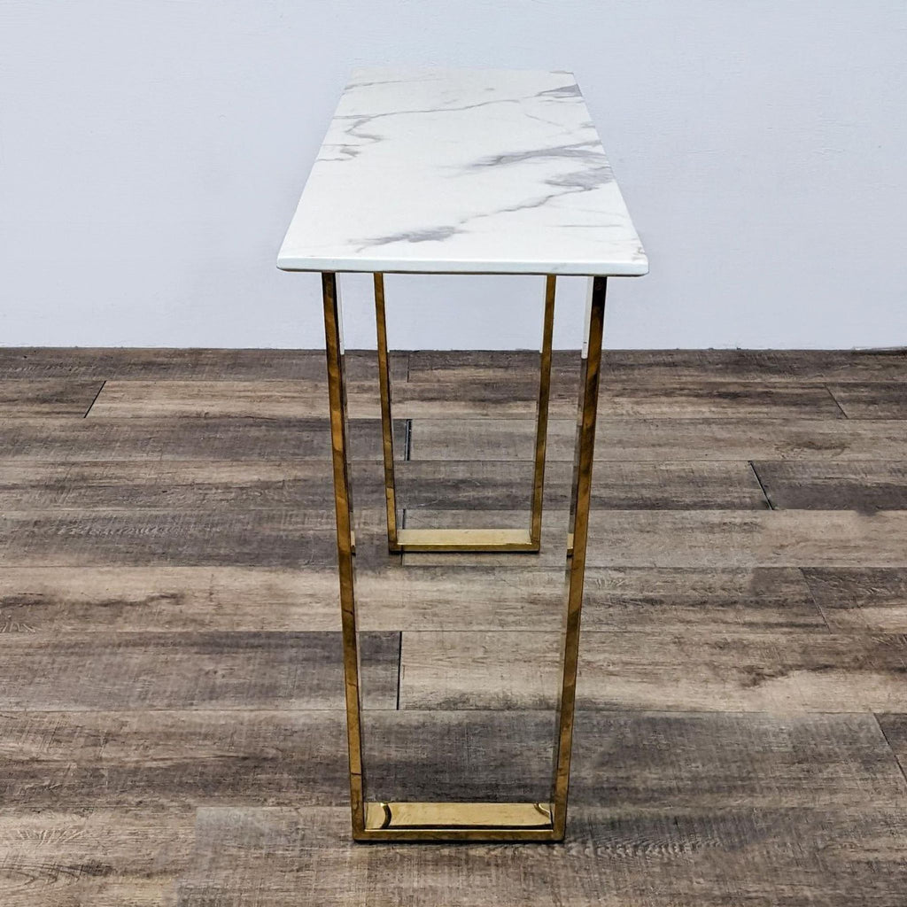 a small side table with a marble top.