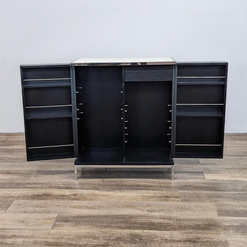 Open black cabinet with side storage, showing missing interior shelving.