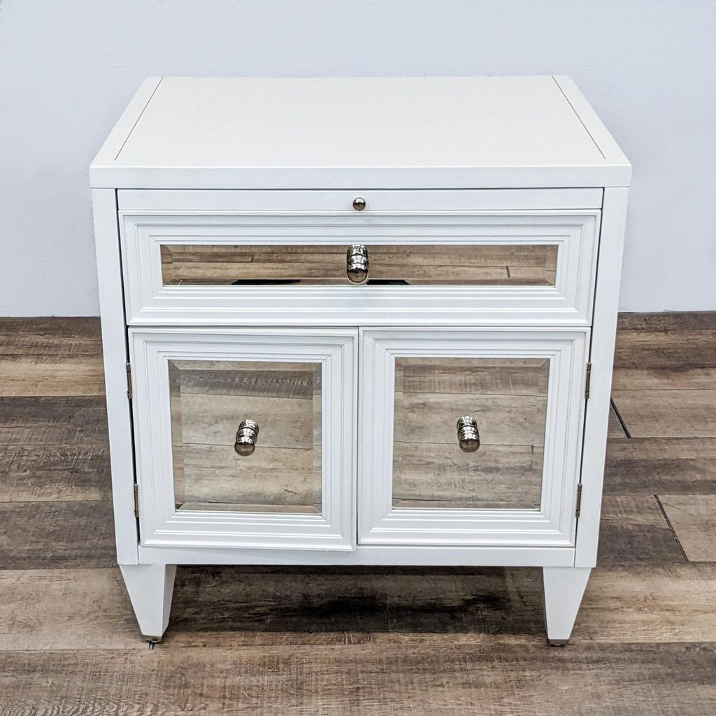 White end table with stepped moulding, beveled mirrors, and decorative knobs.