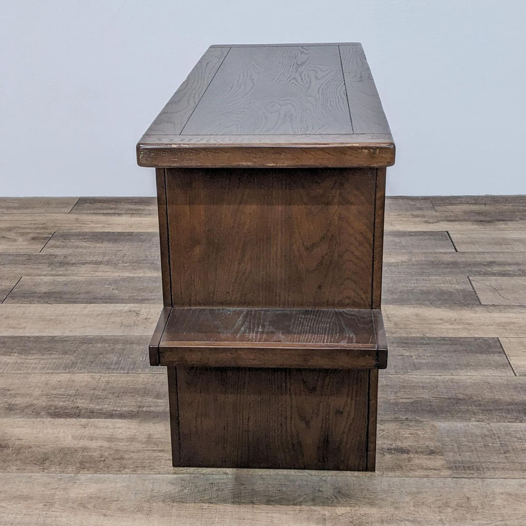 Side view of dark wood console table showing the smooth finish and sturdy construction.