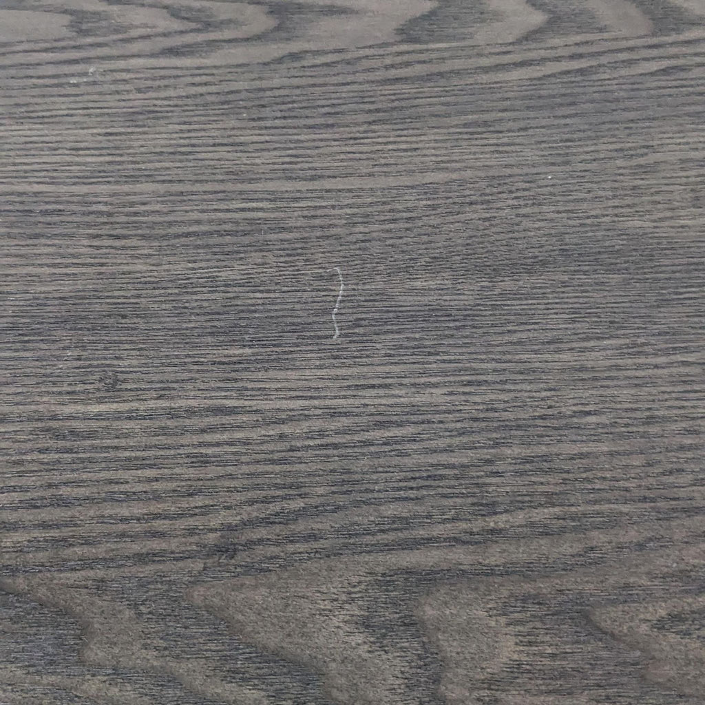 Close-up of the wood grain texture on a Crown Mark end table surface.