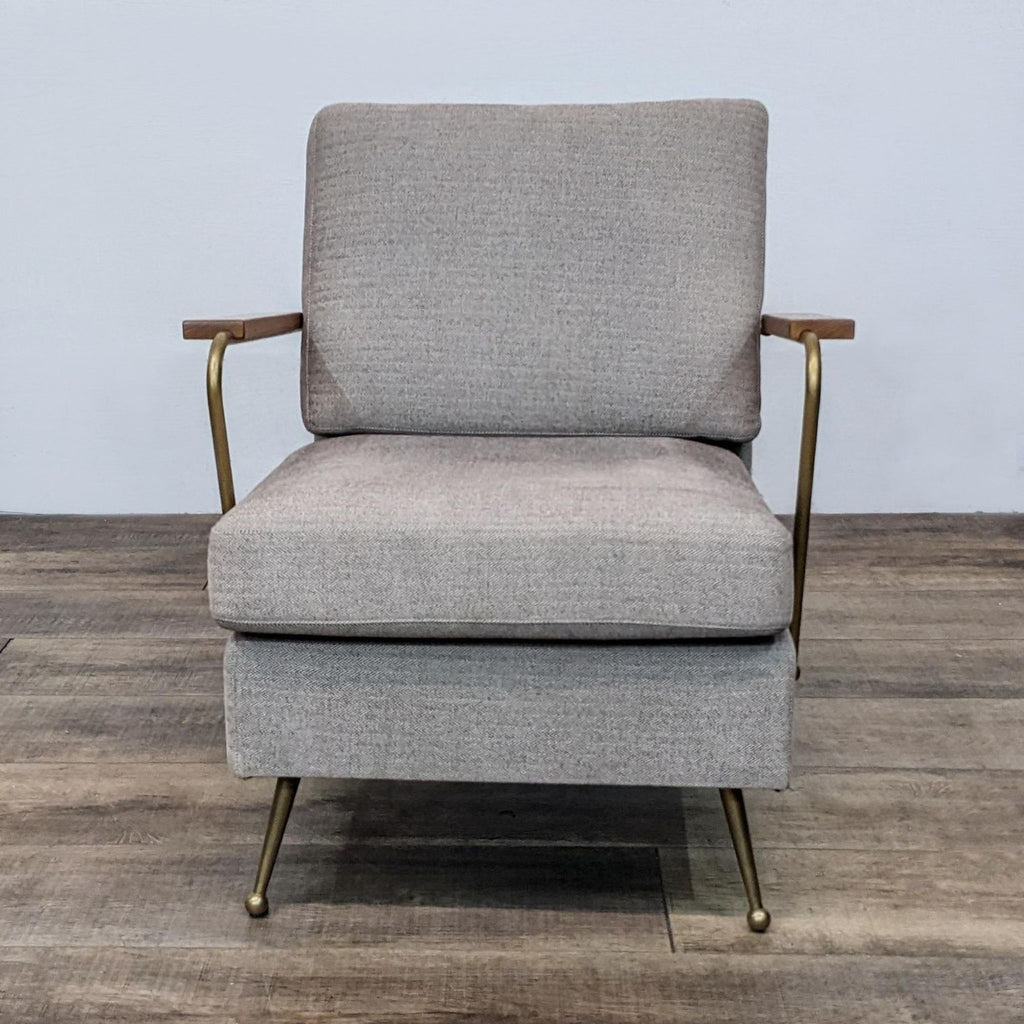 Front view of a modern lounge chair with brass frame and walnut arms.