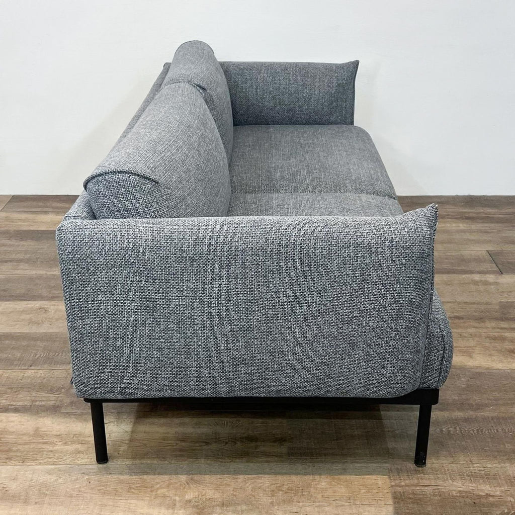 Compact IKEA gray loveseat with sleek design and sturdy metal frame.