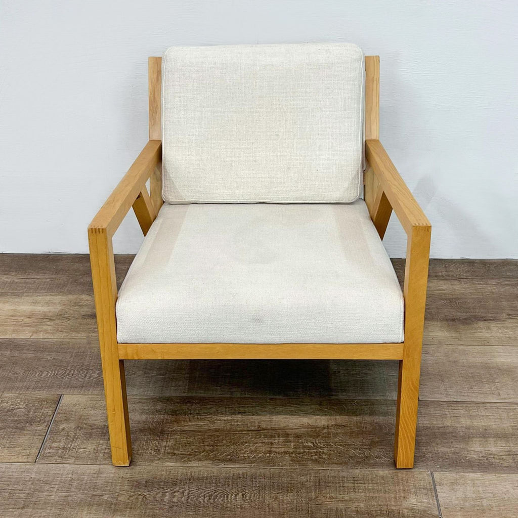 Front view of Guss Modern chair, natural finish wood, upholstered cushions.