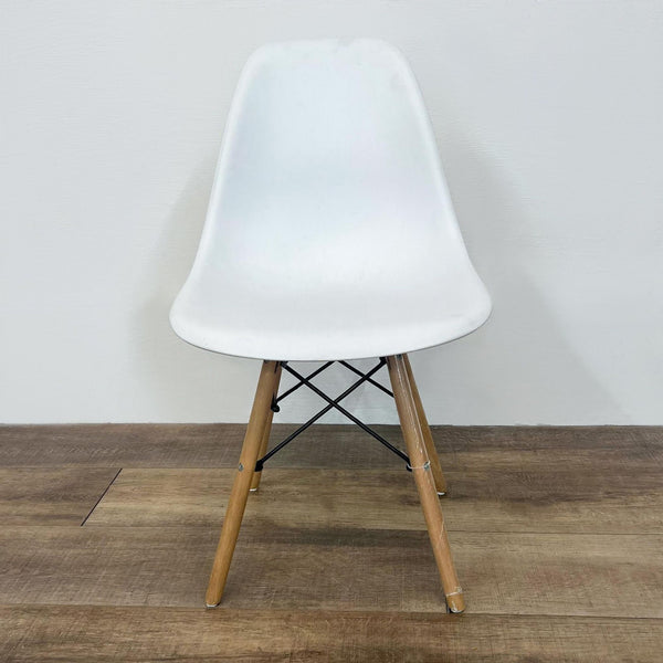 a chair with a wooden frame on top of it 