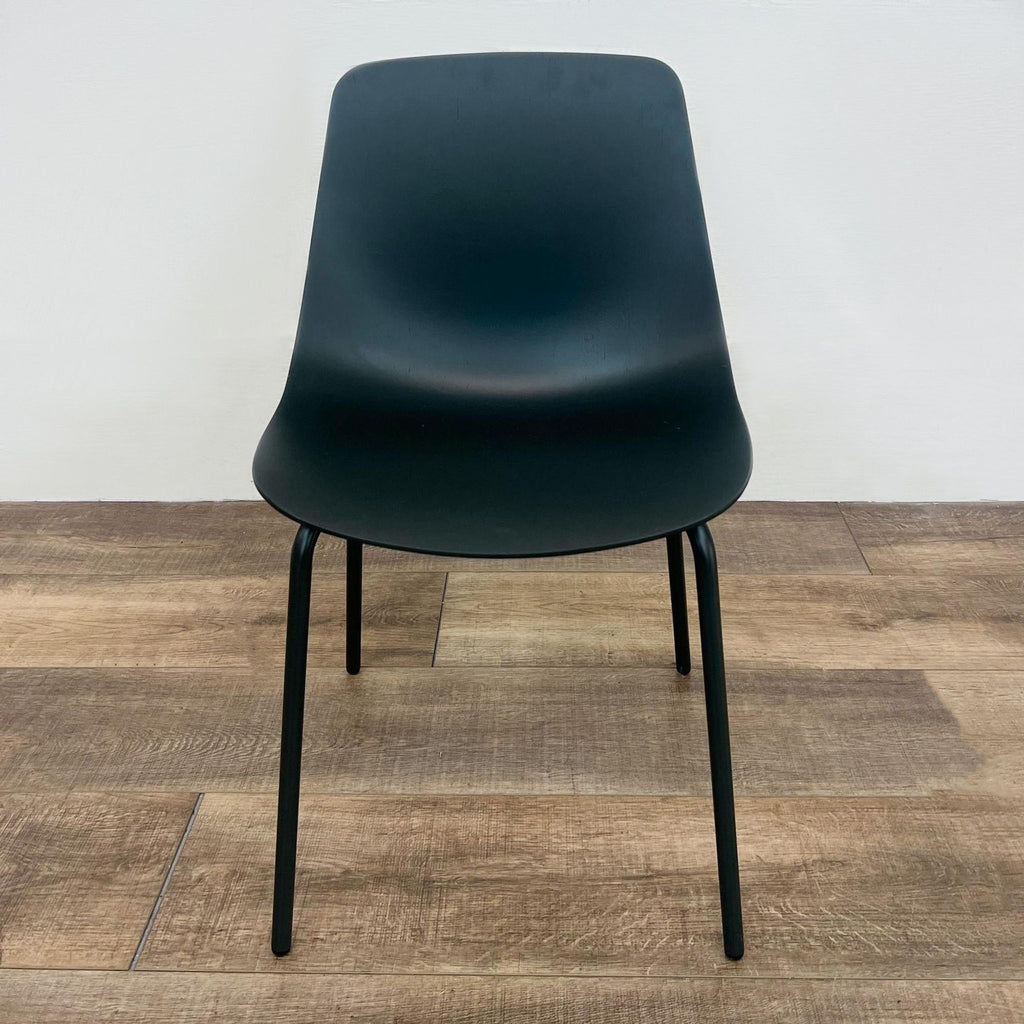 The Clean Cut chair by Blu Dot with a 3D bent steel base and plywood seat, front view.