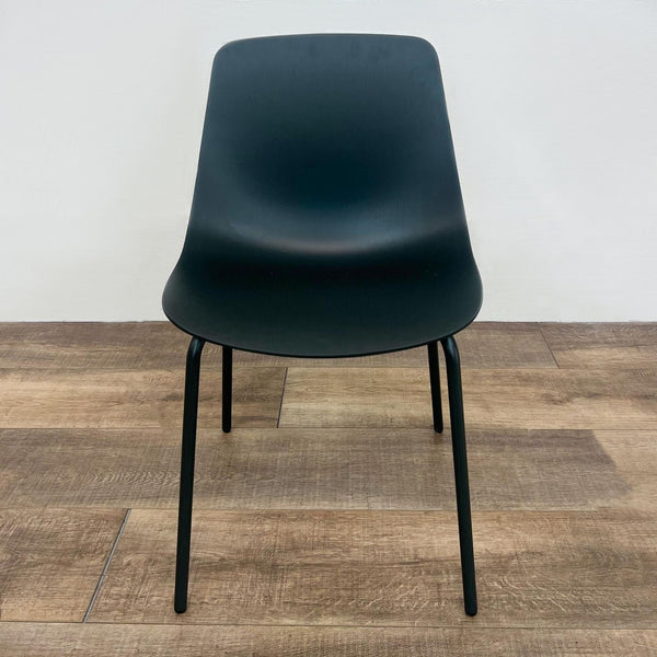The Clean Cut chair by Blu Dot with a 3D bent steel base and plywood seat, front view.