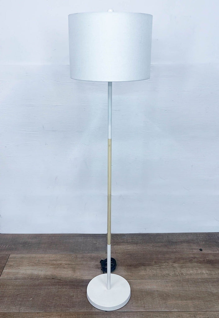 a pair of floor lamps in the style of [ unused0 ].