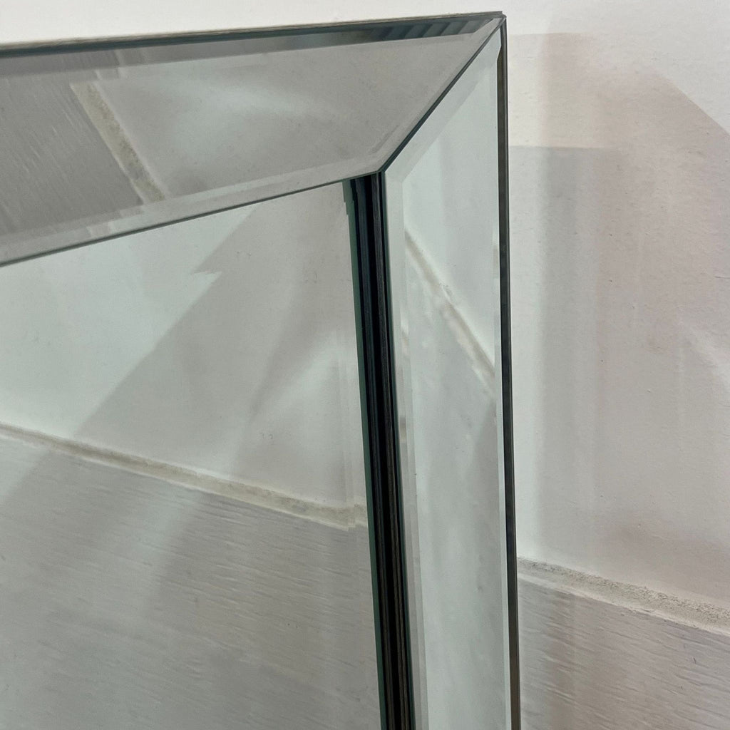 Close-up of the beveled edge on Reperch mirror, highlighting modern design.
