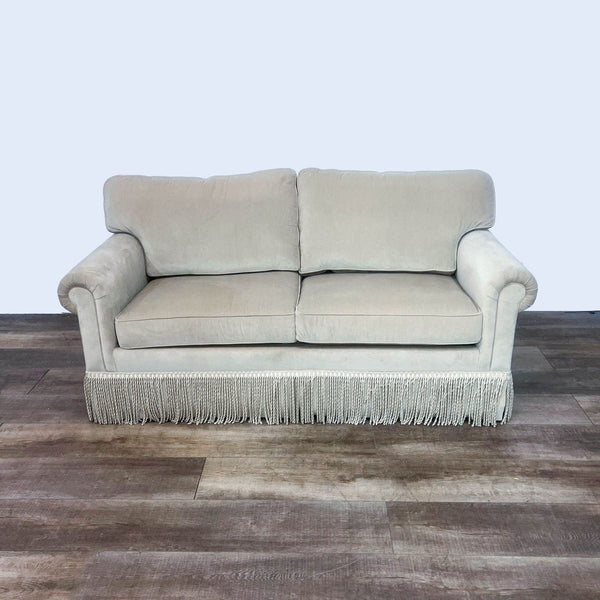 3-seat camel fabric sofa with rolled arms and bullion trim.