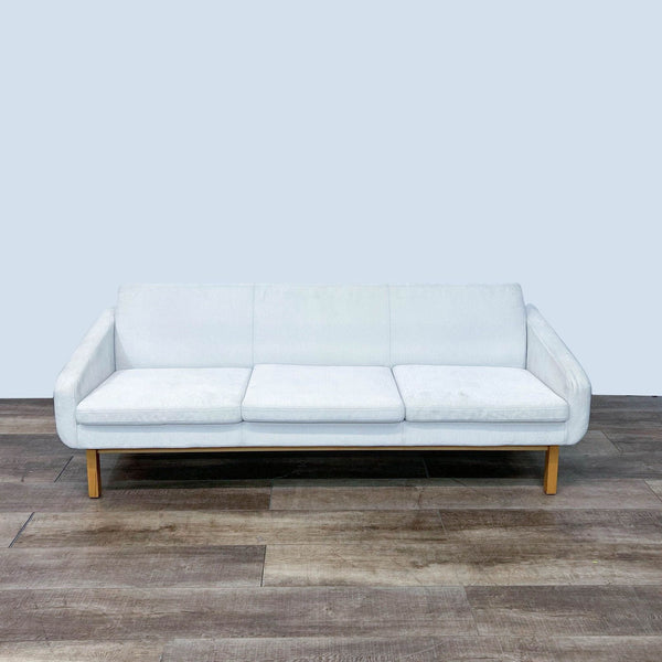 HD Buttercup 3-seat sofa in white fabric with wooden legs and back detail, shown from the front. 
