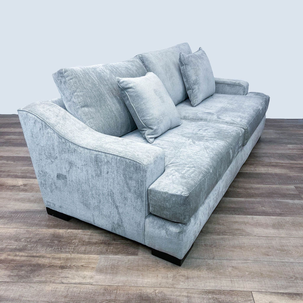 Side view of chenille sofa showcasing armrest and cushions.