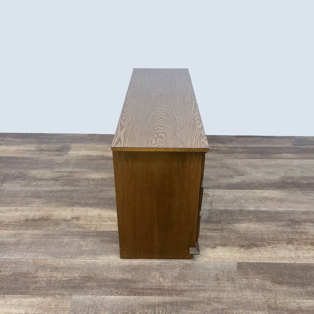 Slim side profile of Reperch's vintage 6-drawer dresser from Ward Furniture on wood floor.