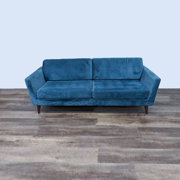 Modern 3-seat sofa with clean lines and tapered legs in blue fabric.