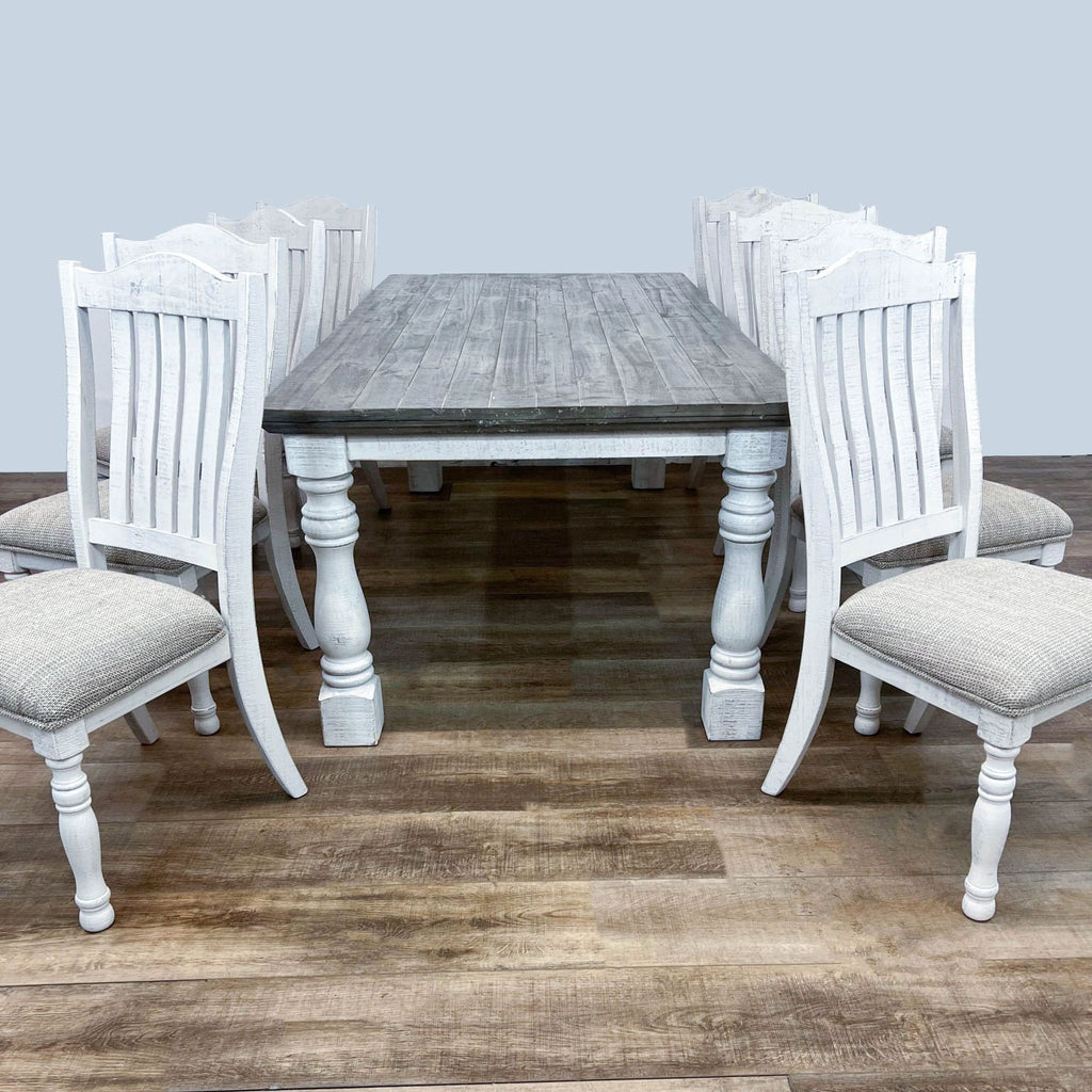 Ashley Furniture 7-piece dining set with a distressed table and six slat back chairs.