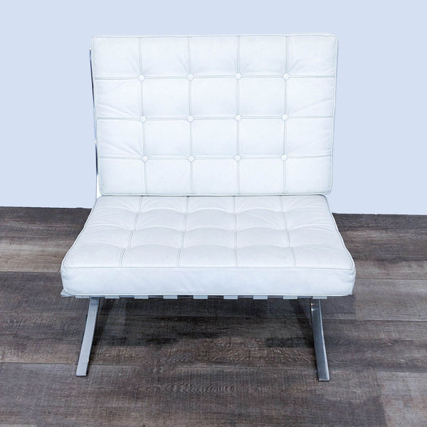 Front view of a white leather lounge chair with tufted squares.