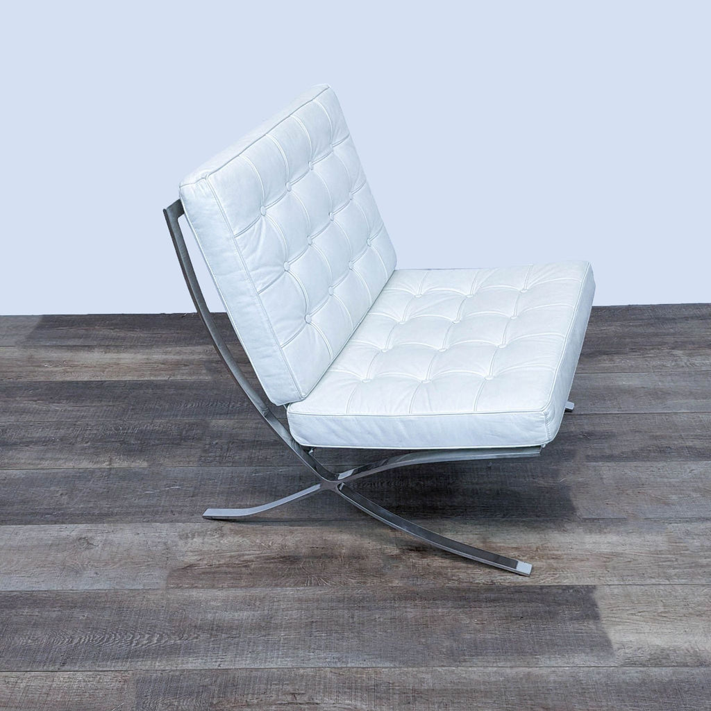 Side angle of a modern white leather chair with chrome frame.