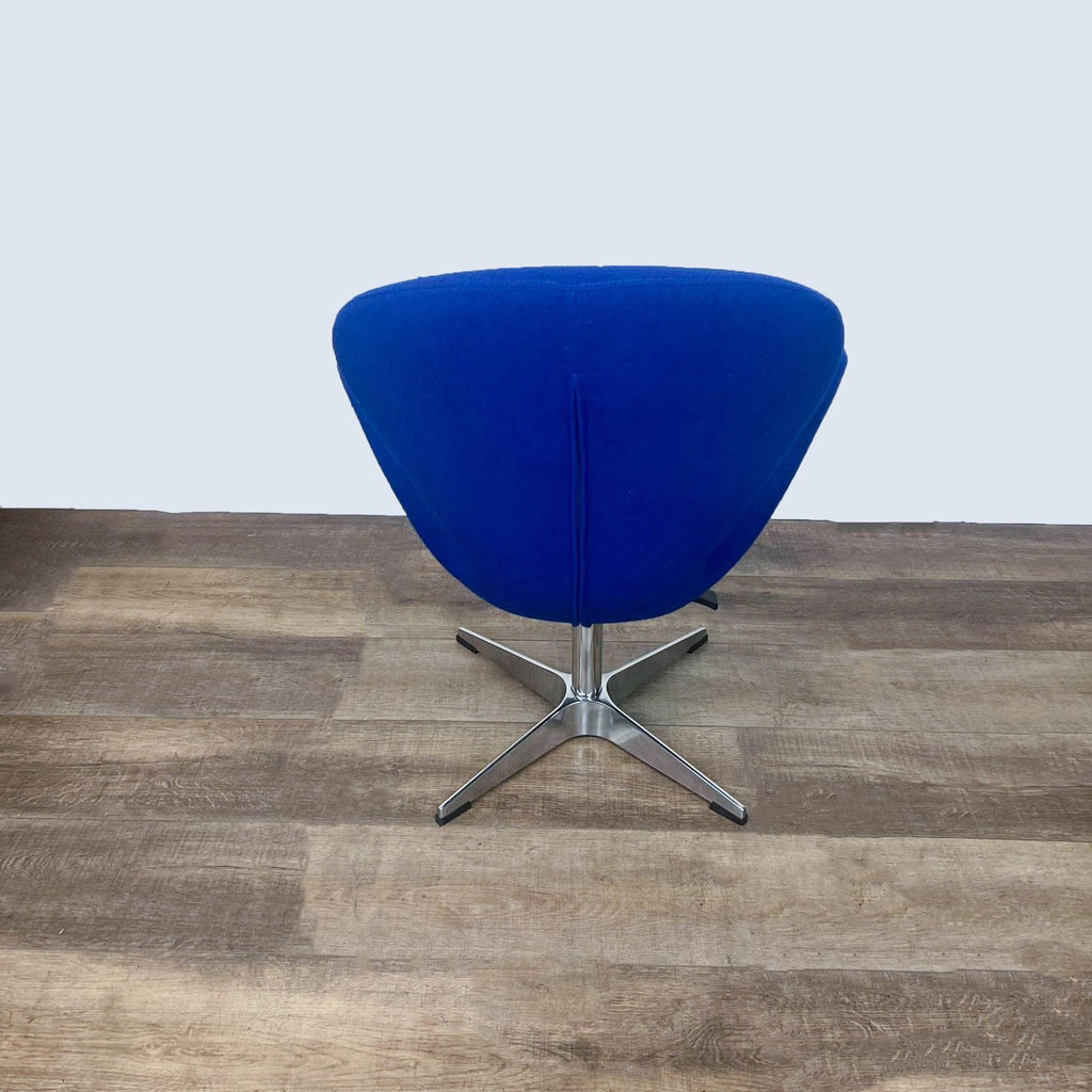 Comfort-focused Arne Emil-inspired chair with unobtrusive silhouette and swivel pedestal for versatile seating.