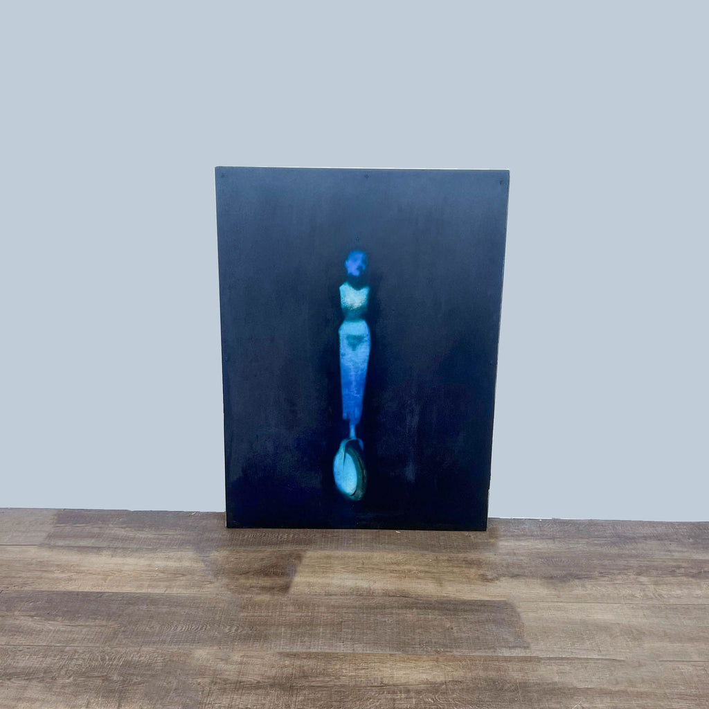 Painting "Jonah Wheel" by artist Todd Murphy, featuring a figurative design on a dark canvas.