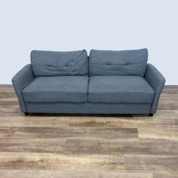 Gray fabric loveseat with tufted back, narrow arms, and dark feet.