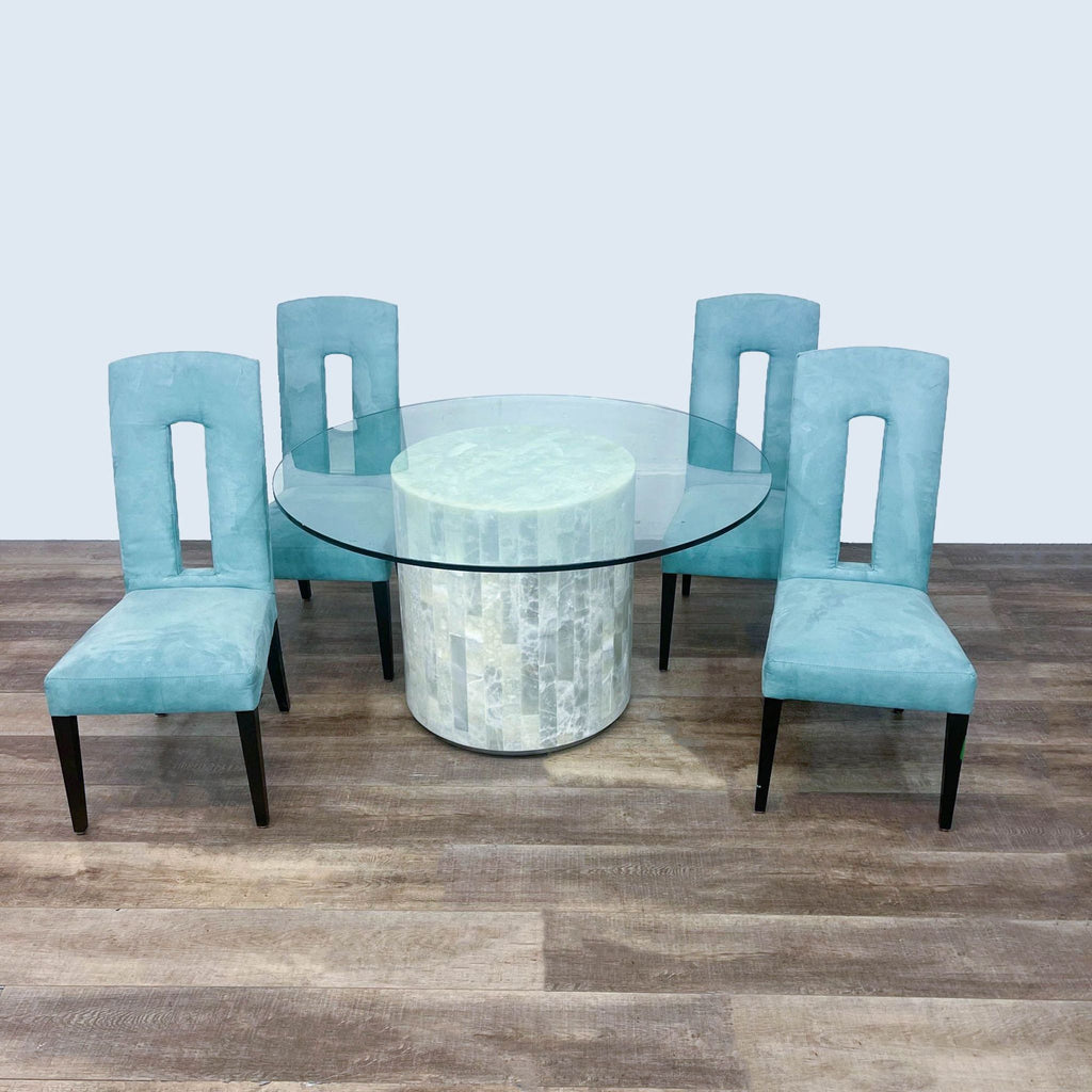 Dining set by Artistica features a glass table and four high back upholstered chairs with wood legs.
