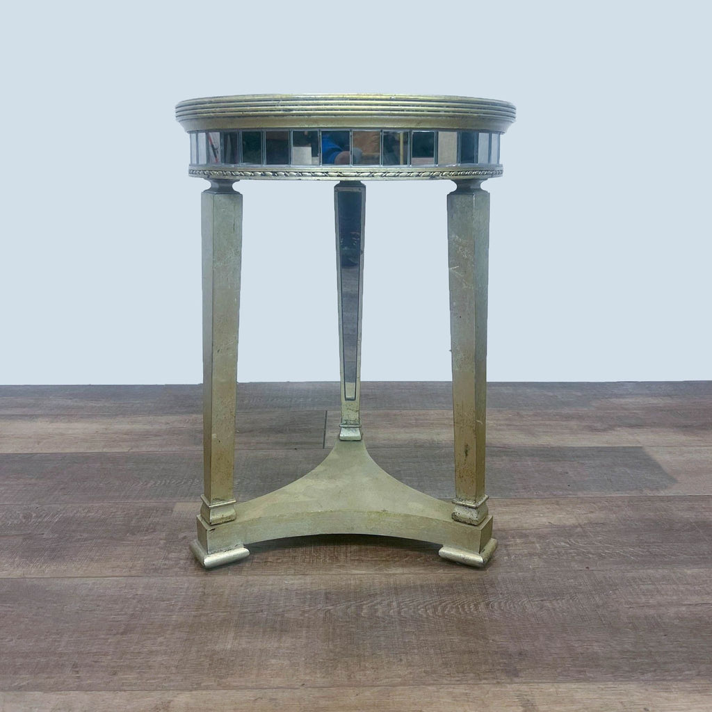 Side view of round mirrored table by Reperch.