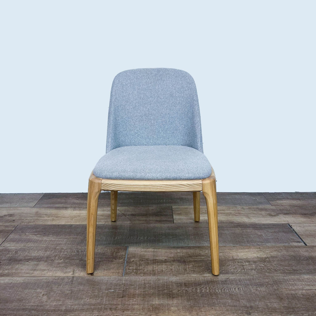 Reperch dining chair with light honey wood frame and high-performance fabric, front view.