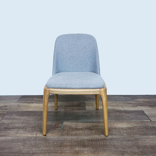 Reperch dining chair with light honey wood frame and high-performance fabric, front view.