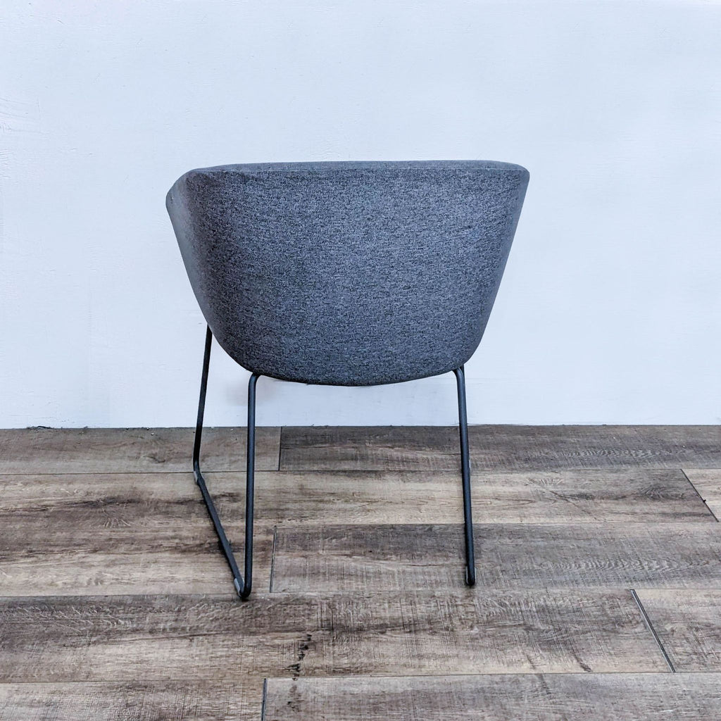 Back view of cozy lounge chair with sturdy steel frame.