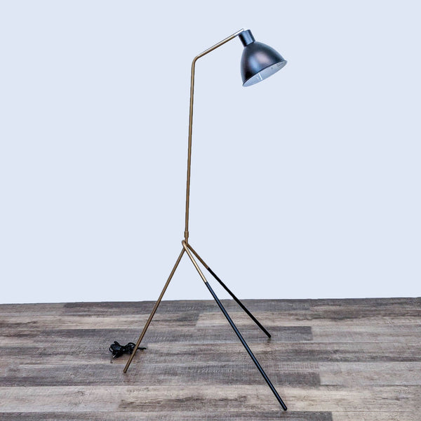 Reperch floor lamp with a metal dome shade on a sleek tripod stand.