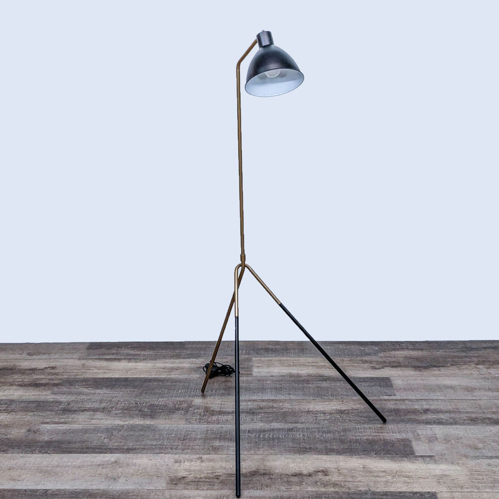 Modern floor lamp by Reperch, featuring a minimalist tripod design.
