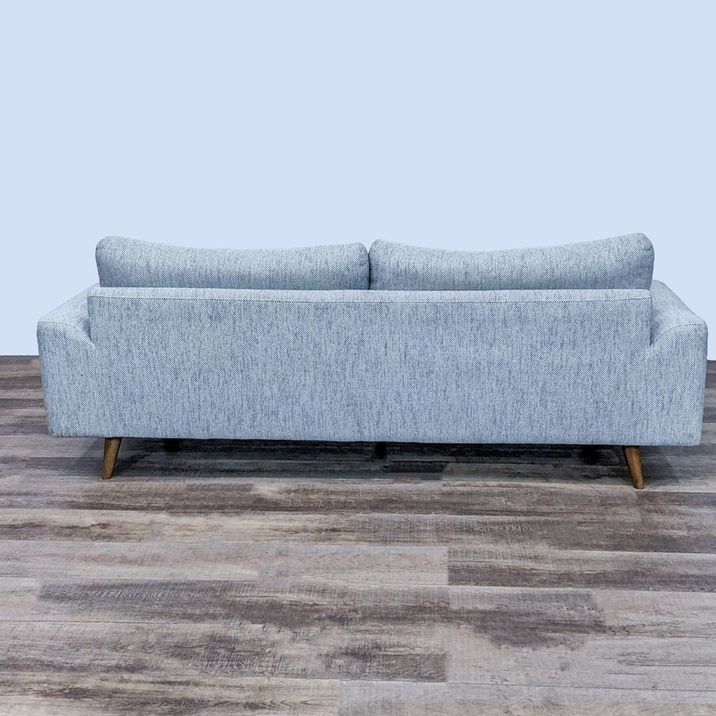 Rear view of a 3-seat sofa showing clean lines and tapered legs.