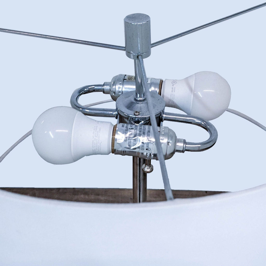 Close-up of bulb fittings inside a modern floor lamp.