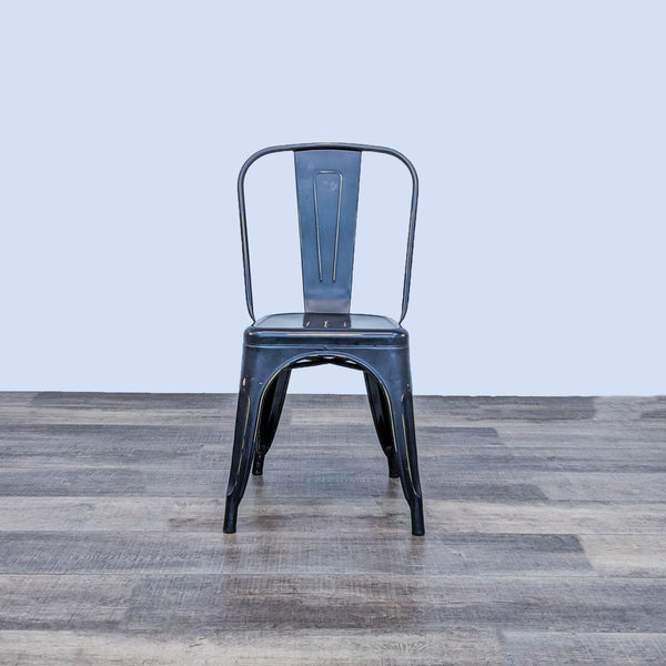 the chair is made of steel and has a black metal frame.