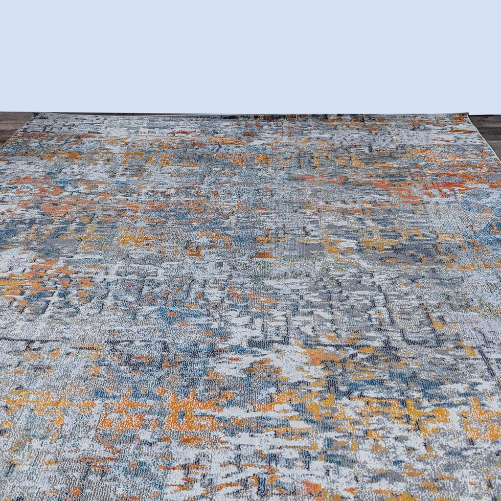 Area rug with a blend of traditional motifs and colorful abstract patterns on a muted background.
