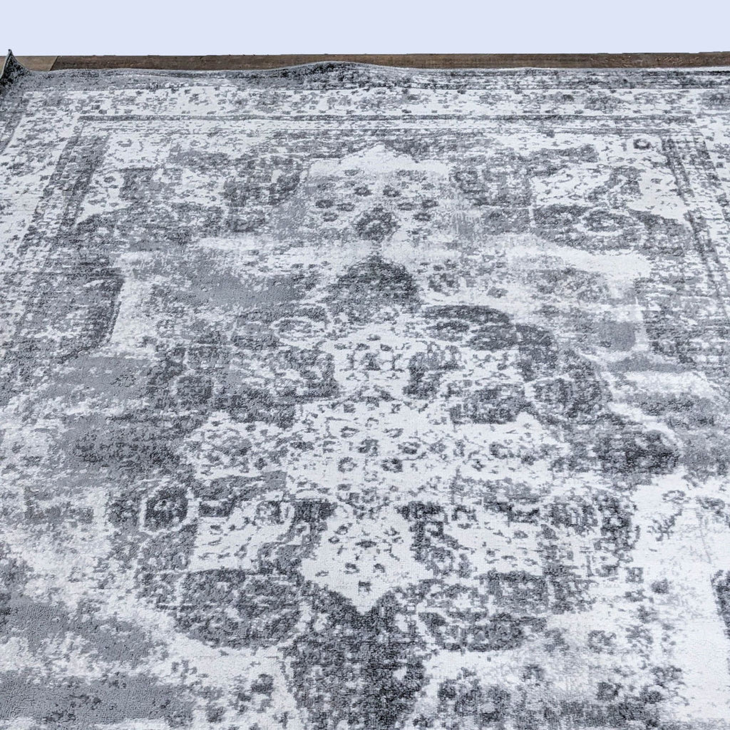 a carpet with a pattern of a woman on it