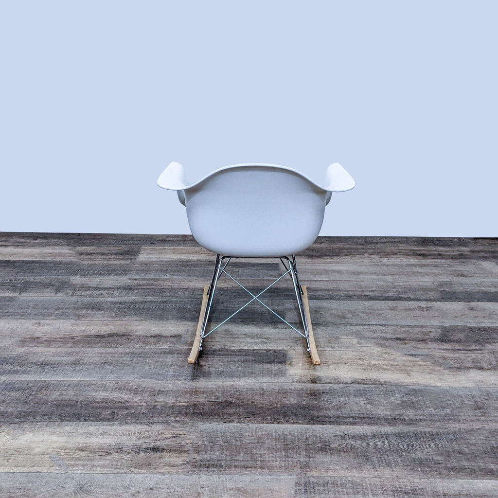 Back view of white polypropylene rocker with wooden rockers.