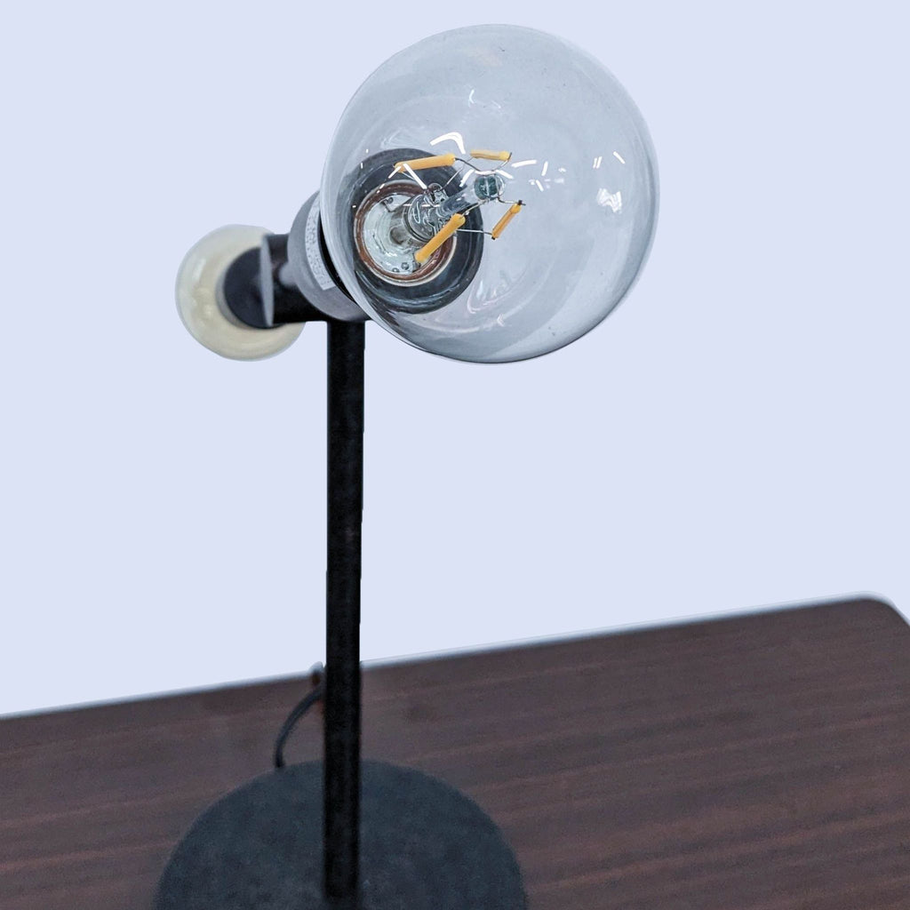 Close-up of Reperch lamp, focusing on large round bulb.
