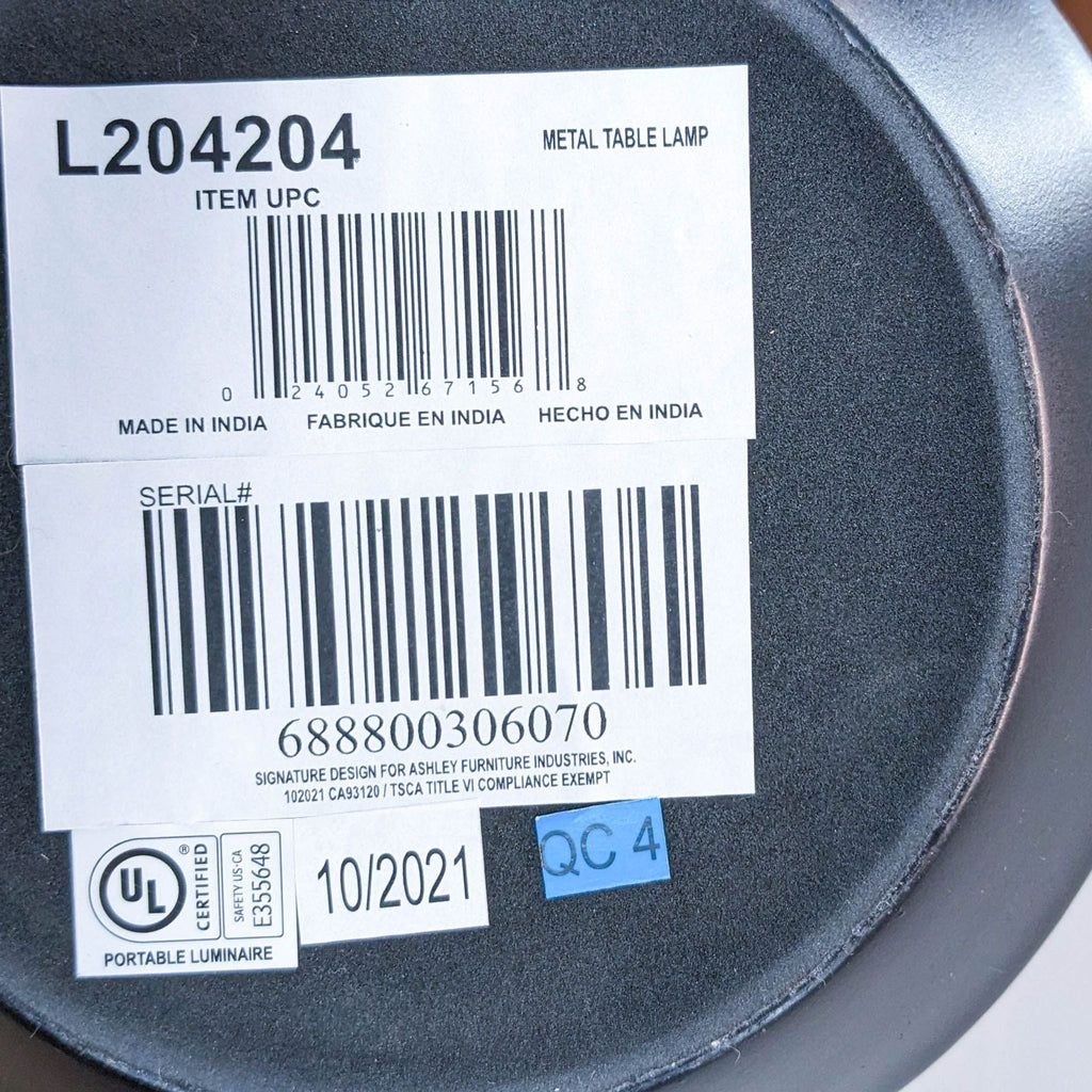 Label with barcode and manufacturing details on lamp base.