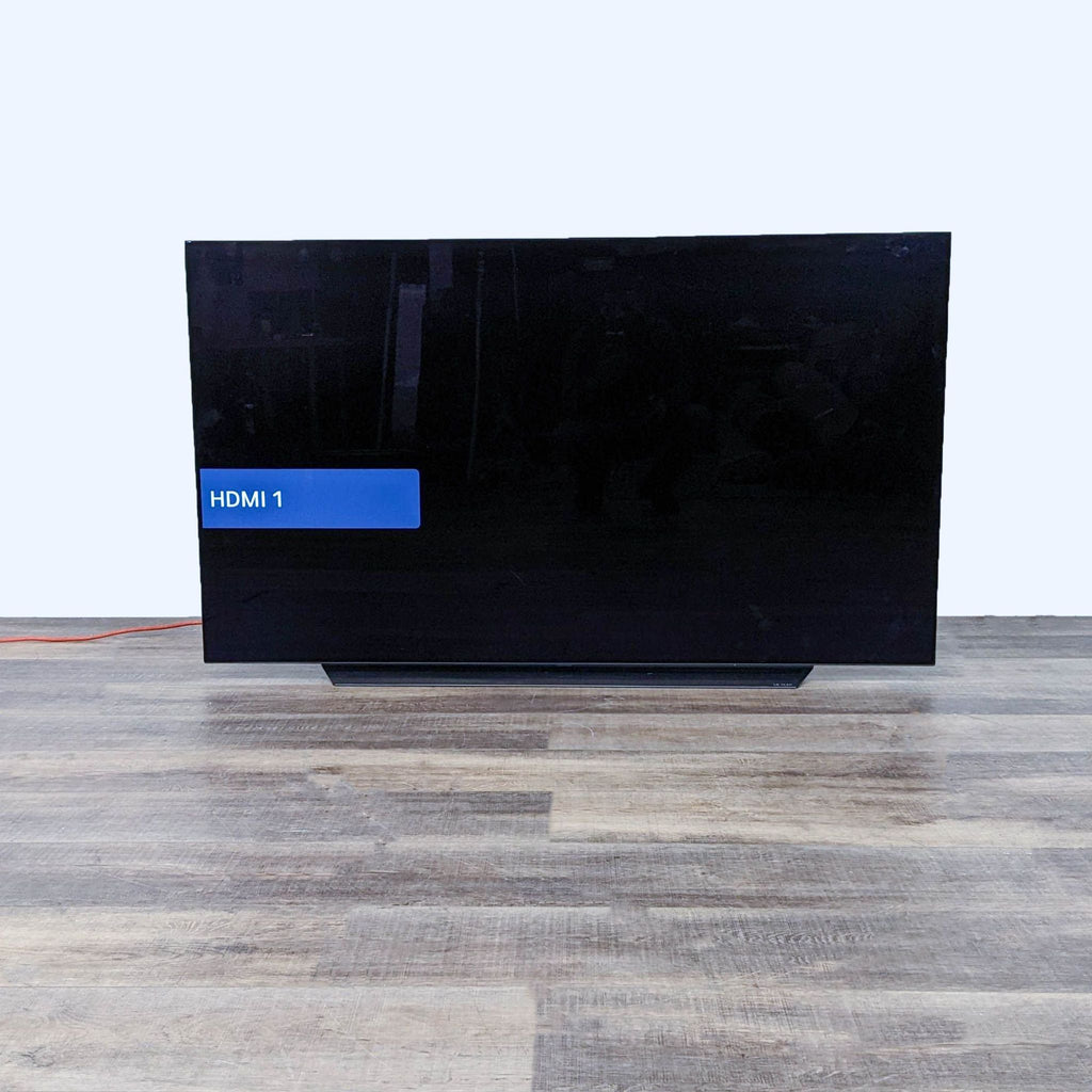 LG TV with HDMI 1 input selected on the screen.