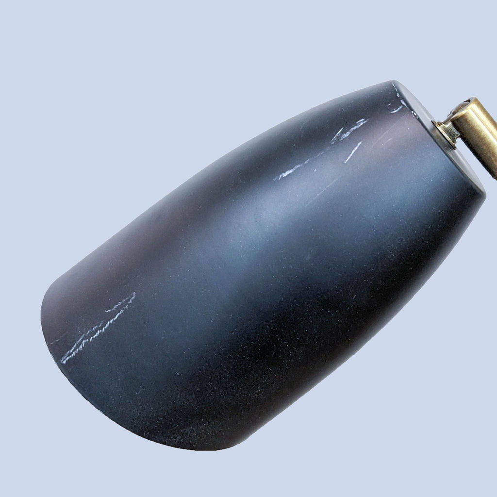 Close-up of a black lamp shade with subtle texture detail from Reperch lighting.